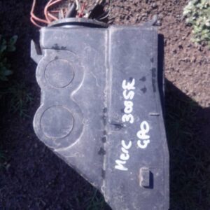 Front angled view of a used fuse box for a Mercedes Benz 300 SE showing wiring and connectors.Front angled vie