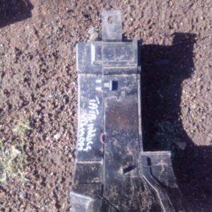 Top-down view of a used compact fuse box with multiple fuses and connectors visible.Top-down view of a used co
