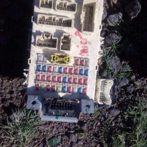 Used fuse box for Nissan Micra shown from the top angle with visible connectors and wiring points.Used fuse bo