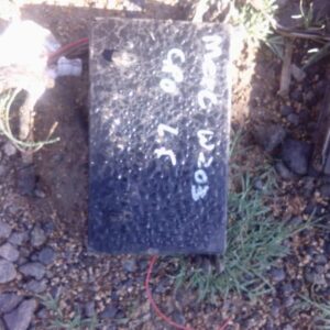 Top view of a used Mercedes W203 fuse box showing circuit connection points and wiring slots.Top view of a use