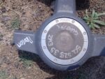 Front-facing view of a used steering wheel airbag module for a Proton Satria, showing central housing and conn