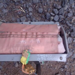 Front view of a used Volvo S60 dashboard with deployed airbag visible on passenger side.Front view of a used V