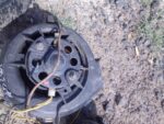 Front-facing view of a used automotive blower fan showing visible blades and mounting points.Front-facing view