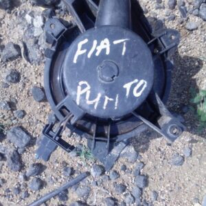 Used blower fan viewed from front side showing circular housing and attached motor details.Used blower fan vie
