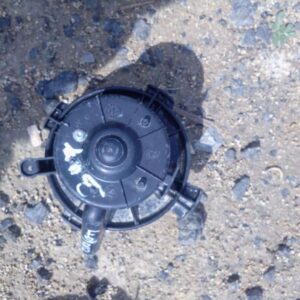 Used blower fan for Peugeot 307 shown from a side angle with electrical connector visible.Used blower fan for