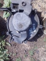 Front angle view of a used blower fan for Mercedes W203 showing fan blades and housing.Front angle view of a u