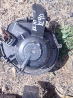 Front view of a used blower fan assembly for Volvo XC90 showing fan blades and housing in good condition.Front