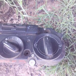 Top-down view of a used Volkswagen Golf 5 climate control panel with dials and digital display.Top-down view o
