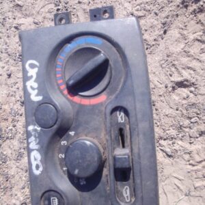 Front view of used climate control panel for Chevrolet Aveo with visible buttons and display screen.Front view