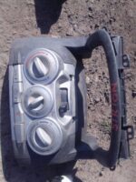 Dashboard climate control panel for Daihatsu Sirion, front view, used condition.Dashboard climate control pane
