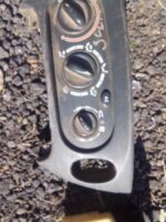Front view of used climate control unit for Renault Scenic showing buttons and dial panel.Front view of used c
