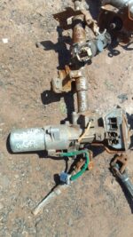Used electric steering column for Datsun Go, shown from an angled top-down view on a white background.Used ele