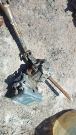 Front view of a used Volkswagen Polo electric steering column with wiring and connectors attached.Front view o
