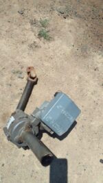 Front view of a used electric steering column for Mazda 2, showing the main shaft and mounting points.Front vi