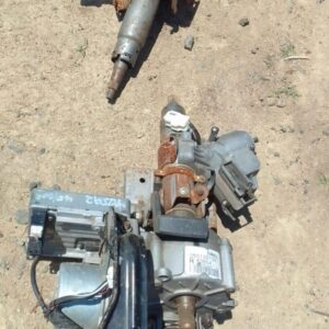 Used electric steering column for Mazda 2, shown from a top angle with wiring and mounting points visible.Used