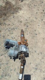Used electric steering column for a 2010 Ford Fiesta, shown from front and side angles.Used electric steering