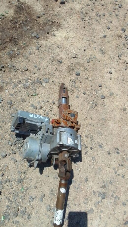 2010 Ford Fiesta Electric Steering Column - Used Used electric steering column for a 2010 Ford Fiesta, shown from front and side angles.Used electric steering