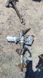 Used electric steering column for Nissan Micra, front angle view showing wiring and mounting points.Used elect