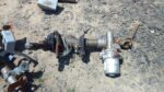 Used electric steering column for a Peugeot 107, front view showing full length and connectors.Used electric s