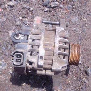 Front angled view of a used car alternator with mounting points and pulley visible.Front angled view of a used