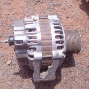 Used car alternator shown from front angle, displaying housing and pulley, clean and intact.Used car alternato