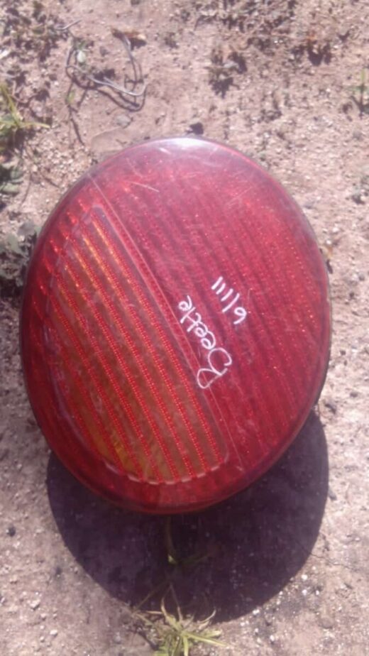 2006 Volkswagen Beetle Left Taillight - Used Used left taillight for Volkswagen Beetle shown from the rear angle with wiring harness attached.Used left tai