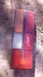 Right taillight for Volkswagen Golf 1, used condition, shown from rear angled view.Right taillight for Volkswa