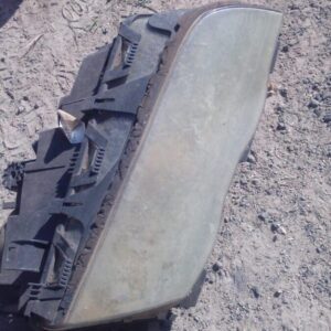 Right front headlight for BMW E46, used condition, shown from front angle.Right front headlight for BMW E46, u