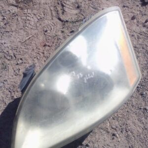 Left side headlight for Chery J5, shown front angle, used condition with clear glass and intact housing.Left s