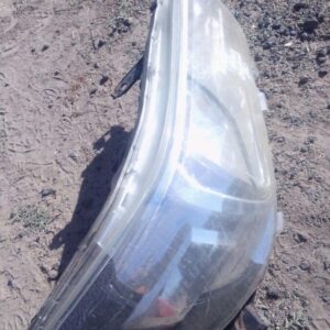 Used right headlight for Toyota Hilux GD6, clear lens with mounting points visible from front angle.Used right
