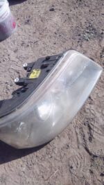 Right-side used headlight for Volkswagen Crafter, shown front angle.Right-side used headlight for Volkswagen C