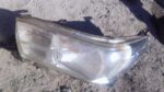 Left front headlight assembly for Toyota Hilux GD6, used condition, shown from front angle.Left front headligh