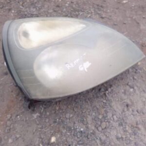 Used right-side headlight for Renault Clio 2 showing front lens and mounting points, clean surface visible.Use