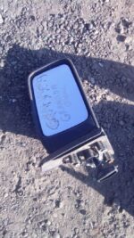 Right side exterior mirror for Ford Granada shown from an angled front view, used condition.Right side exterio