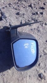 Right side view mirror for Nissan Micra, shown from front angle, used condition.Right side view mirror for Nis