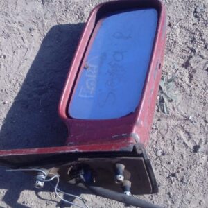 Used right side exterior mirror for Ford Sierra shown angled from the rear side with mounting bracket.Used rig