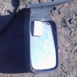 Right side exterior mirror for a 1994 Ford Sapphire, shown used, angled slightly downward against a white back