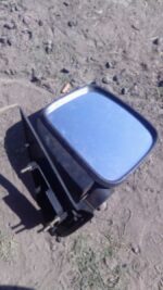 Right side used car door mirror shown from a slightly angled front view on a white background.Right side used