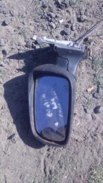 Used left side mirror for Opel Astra shown from front angle against white background.Used left side mirror for