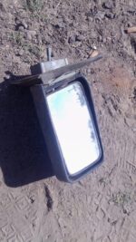 Right side exterior mirror for Nissan Sentra, used condition, shown angled from front side.Right side exterior