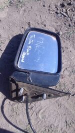 Left side exterior mirror for Toyota Hilux, shown from front angle, used condition visible.Left side exterior