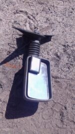 Right side exterior mirror for Fiat Uno shown from front angle, used condition.Right side exterior mirror for