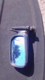 Left side exterior mirror for Audi 500, used condition, shown from the front angle.Left side exterior mirror f