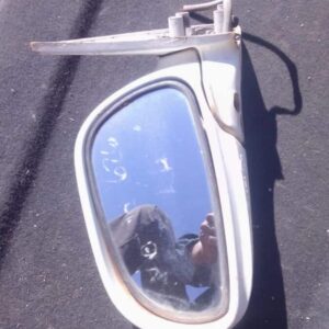 Used left side exterior mirror for 1997 Mazda 626, shown from an angled front view.Used left side exterior mir