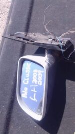Used left side mirror for Volkswagen Polo, shown from front angle with black housing and glass intact.Used lef