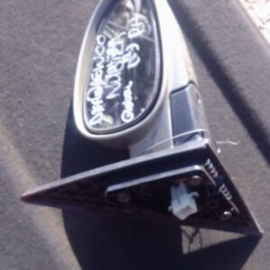 Right side car mirror for Daewoo Nubira, used condition, shown from front angle.Right side car mirror for Daew