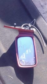Left side car door mirror for Ford Sierra, shown from front angle, used condition visible.Left side car door m