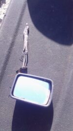 Left side mirror for Volkswagen Golf 1, used condition, shown detached on a plain light background.Left side m