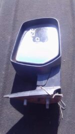 Right side mirror for Ford Ranger, used condition, shown angled from the rear with glass and mounting bracket