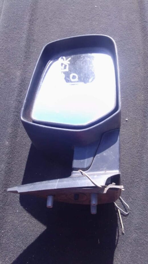 2010 Ford Ranger Right Mirror - Used Right side mirror for Ford Ranger, used condition, shown angled from the rear with glass and mounting bracket